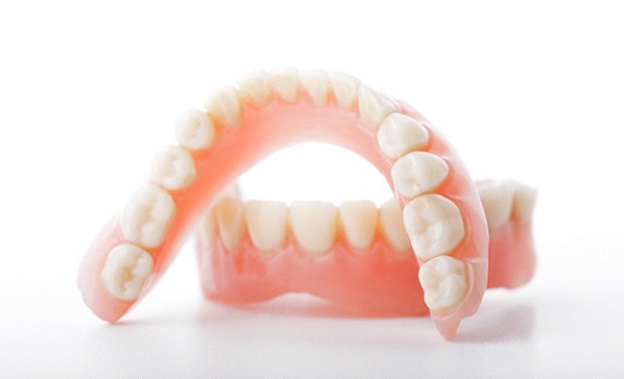 Denture in Lakewood with white background