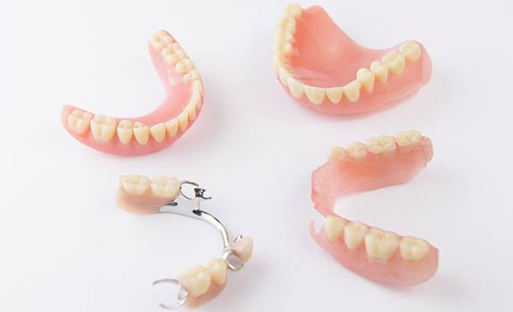 Different types of dentures in Lakewood on white background