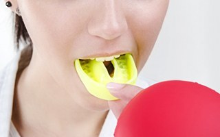 person wearing a yellow mouthguard