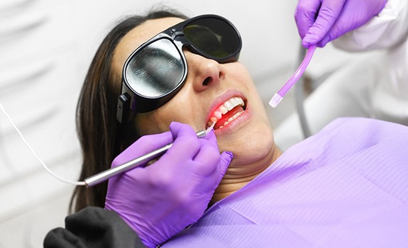 A woman getting laser periodontal treatment