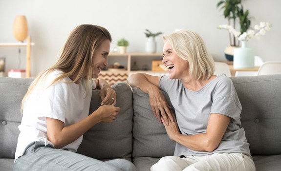 Ladies converse on couch